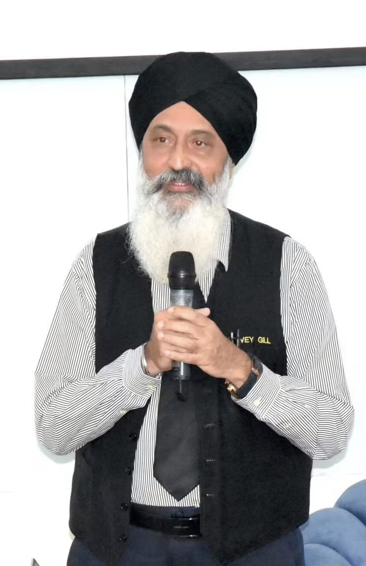 Dr. Harvey Gill leading an executive session